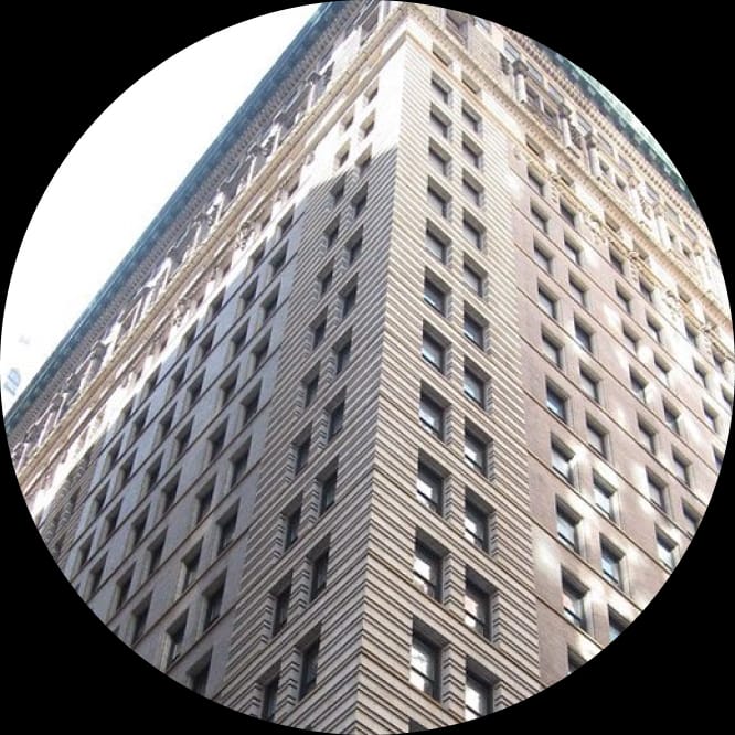 QEWI inspector examining a building facade